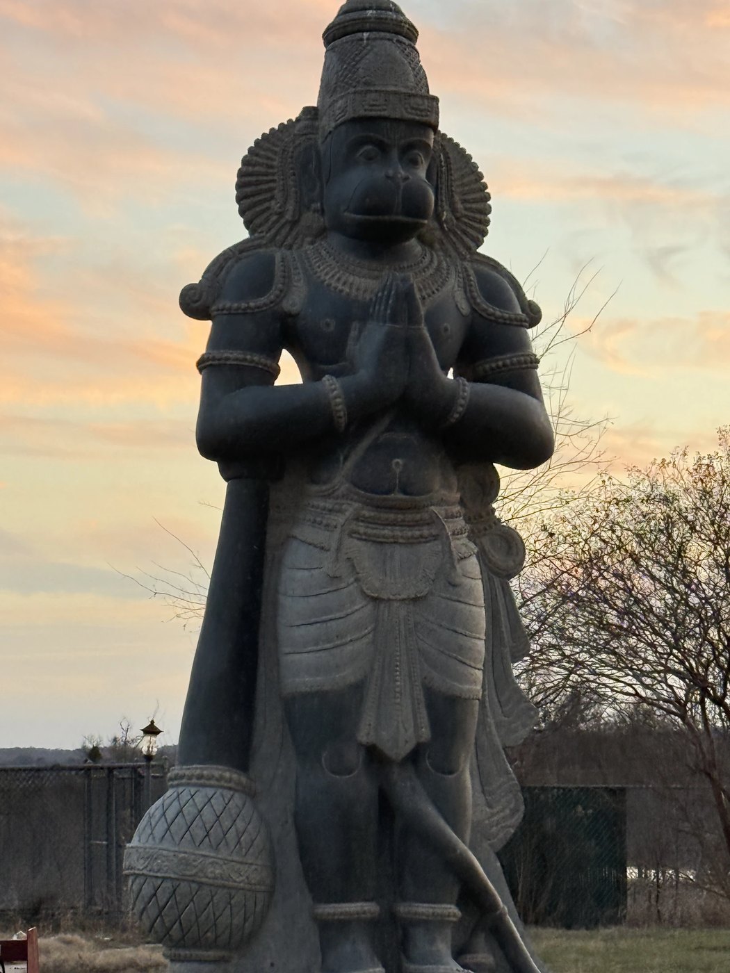Hanuman statue at sunset